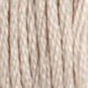 A close-up view of embroidery thread skeins, held taught vertically. The shade is a very light, pale cream, like almond milk