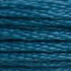 A close-up view of embroidery thread skeins, held taught horizontally. The shade is a deep blue-green, like a swimming pool at night