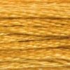 A close-up view of embroidery thread skeins, held taught horizontally. The shade is a rich golden yellow