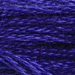 A close-up view of embroidery thread skeins, held taught horizontally. The shade is a bright indigo