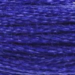 A close-up view of embroidery thread skeins, held taught horizontally. The shade is a light royal blue