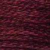 A close-up view of embroidery thread skeins, held taught horizontally. The shade is a dark red-purple, like a black cherry.