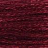 A close-up view of embroidery thread skeins, held taught horizontally. The shade is a dark burgundy, like a glass of rich red wine.