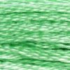 A close-up view of embroidery thread skeins, held taught horizontally. The shade is a very light jewel-like minty green.