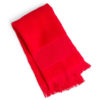 Red towel with fringe and folded in half