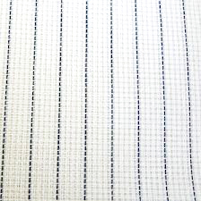 A clos-up on gridded white embroidery fabric