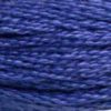A close-up view of embroidery thread skeins, held taught horizontally. The shade is a medium dark true blue shade, a bit more purple than a royal blue, like a rainbow's indigo.