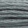 A close-up view of embroidery thread skeins, held taught horizontally. The shade is a medium dark grey shade with bluish undertones, like a gun in the dark.