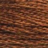 A close-up view of embroidery thread skeins, held taught horizontally. The shade is a deep true brown like fallen autumn leaves.