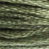 A close-up view of embroidery thread skeins, held taught horizontally. The shade is a medium dark grey with desaturated olive green undertones