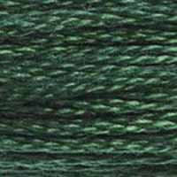 A close-up view of embroidery thread skeins, held taught horizontally. The shade is a beautiful dark green that blends well with #320 Pistachio Green Medium