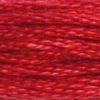 A close-up view of embroidery thread skeins, held taught horizontally. The shade is a bright cheerful red that's perfect for holiday stitching.