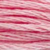 A close-up view of embroidery thread skeins, held taught horizontally. The shade is a light pretty pink a bit darker than a baby pink