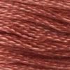 A close-up view of embroidery thread skeins, held taught horizontally. The shade is a dark rusty orangish pink. If your salmon looks like this, you need a new salmon.