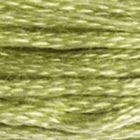 A close-up view of embroidery thread skeins, held taught horizontally. The shade is a lovely pale olive green with yellowish undertones
