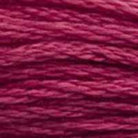 A close-up view of embroidery thread skeins, held taught horizontally. The shade is a dark purplish pink, like raspberry jelly.