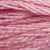 A close-up view of embroidery thread skeins, held taught horizontally. The shade is a pretty medium light pink with purplish undertones