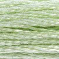 A close-up view of embroidery thread skeins, held taught horizontally. The shade is a pale shade like a baby green, with a hint of greyish undertones, like clover going into fall.