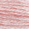 A close-up view of embroidery thread skeins, held taught horizontally. The shade is a light pretty pink, like a baby pink