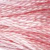 A close-up view of embroidery thread skeins, held taught horizontally. The shade is a medium light pretty pink, a bit stronger than baby pink