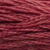 A close-up view of embroidery thread skeins, held taught horizontally. The shade is a medium dark dusty rose with a hint of burgundy