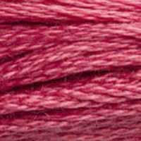 A close-up view of embroidery thread skeins, held taught horizontally. The shade is a medium dark bright pink with a hint of purple