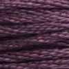 A close-up view of embroidery thread skeins, held taught horizontally. The shade is a dark true purple with a hint of dust