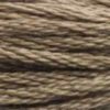 A close-up view of embroidery thread skeins, held taught horizontally. The shade is a medium dark brown with a touch of grey