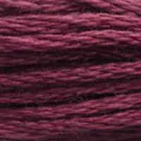A close-up view of embroidery thread skeins, held taught horizontally. The shade is a medium dark dusty purple