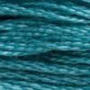A close-up view of embroidery thread skeins, held taught horizontally. The shade is a medium bluish green like the depths of the ocean