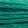 A close-up view of embroidery thread skeins, held taught horizontally. The shade is a medium green with a touch of blue