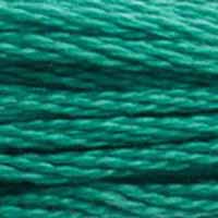 A close-up view of embroidery thread skeins, held taught horizontally. The shade is a medium green with a touch of blue