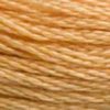A close-up view of embroidery thread skeins, held taught horizontally. The shade is a medium light golden brown with a touch of orange