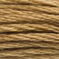 A close-up view of embroidery thread skeins, held taught horizontally. The shade is a medium light creamy brown