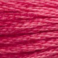 A close-up view of embroidery thread skeins, held taught horizontally. The shade is a medium dark purplish red