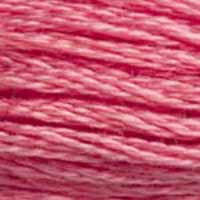 A close-up view of embroidery thread skeins, held taught horizontally. The shade is a medium light pink with a touch or purple