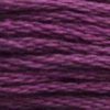 A close-up view of embroidery thread skeins, held taught horizontally. The shade is a dark pure purple.