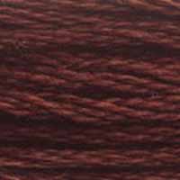 A close-up view of embroidery thread skeins, held taught horizontally. The shade is a deep dark reddish brown