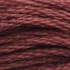 A close-up view of embroidery thread skeins, held taught horizontally. The shade is a medium dark reddish brown