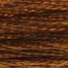 A close-up view of embroidery thread skeins, held taught horizontally. The shade is a medium dark shade of pure brown, like burnt sugar.