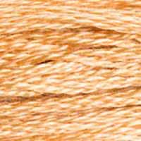 A close-up view of embroidery thread skeins, held taught horizontally. The shade is a  light shade of tan brown with a hint of peach, like a perfectly ripe apricot.