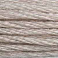 A close-up view of embroidery thread skeins, held taught horizontally. The shade is a pretty light shade of grey with a just a hint of purplish undertones, like beach sand under sunset.