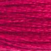 A close-up view of embroidery thread skeins, held taught horizontally. The shade is a bright red that leans a bit towards pink, like a poinsettia.
