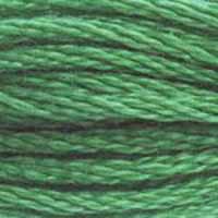 A close-up view of embroidery thread skeins, held taught horizontally. The shade is a medium beautiful green, like a the felt on a pool table.