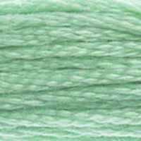 A close-up view of embroidery thread skeins, held taught horizontally. The shade is a lovely medium light green, just the colour of classical Chinese jade