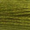 A close-up view of embroidery thread skeins, held taught horizontally. The shade is a medium dark shade of green with golden yellow undertones, like a meadow just past high summer