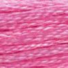 A close-up view of embroidery thread skeins, held taught horizontally. The shade is a pretty medium light pink shade, like like a new flavour of bubblegum