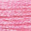 A close-up view of embroidery thread skeins, held taught horizontally. The shade is a pretty light pink shade, like strawberry Poky. 