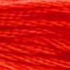 A close-up view of embroidery thread skeins, held taught horizontally. The shade is a brilliant bright orange that leans a bit into red, like ripe tomatoes canned in a mason jar.