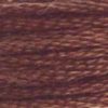 A close-up view of embroidery thread skeins, held taught horizontally. The shade is a dark shade of brownish mauve, like hazelnut hot chocolate